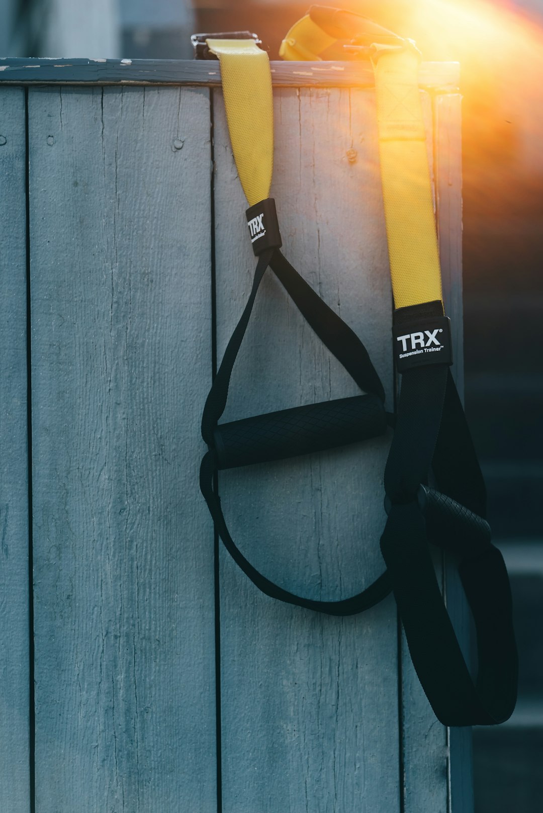 Are online personal training sessions as effective as in-person training sessions? by Virtual Personal Trainers black and yellow TRX resistance band