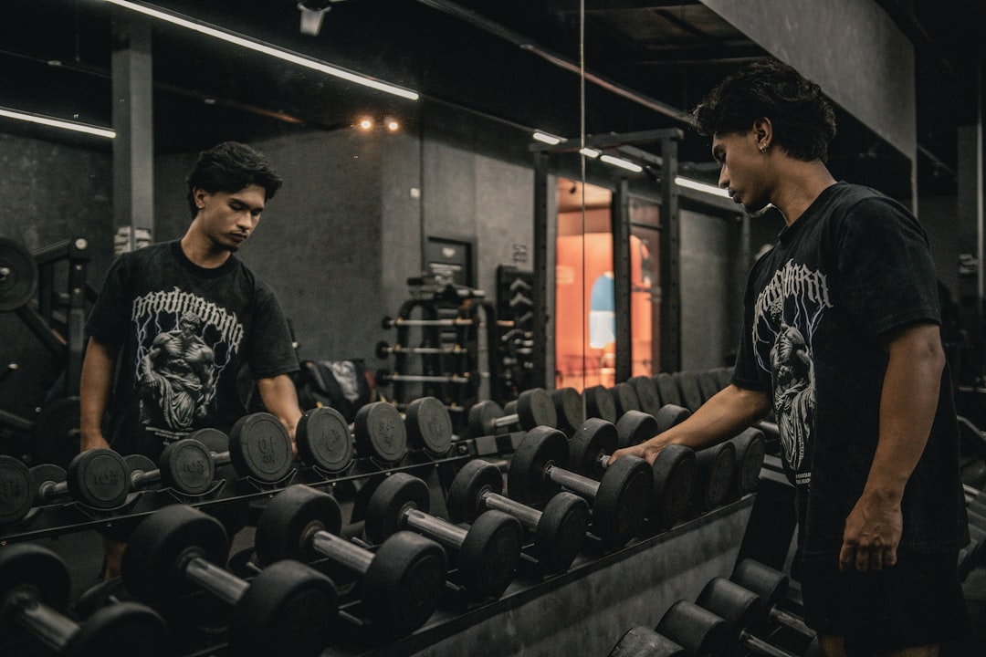 How much should you see a personal trainer? by Virtual Personal Trainers A couple of men standing next to each other in a gym